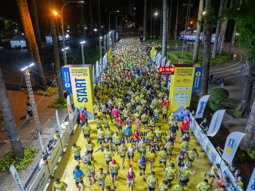Participants start the Ho Chi Minh City night marathon, showcasing energy and unity.